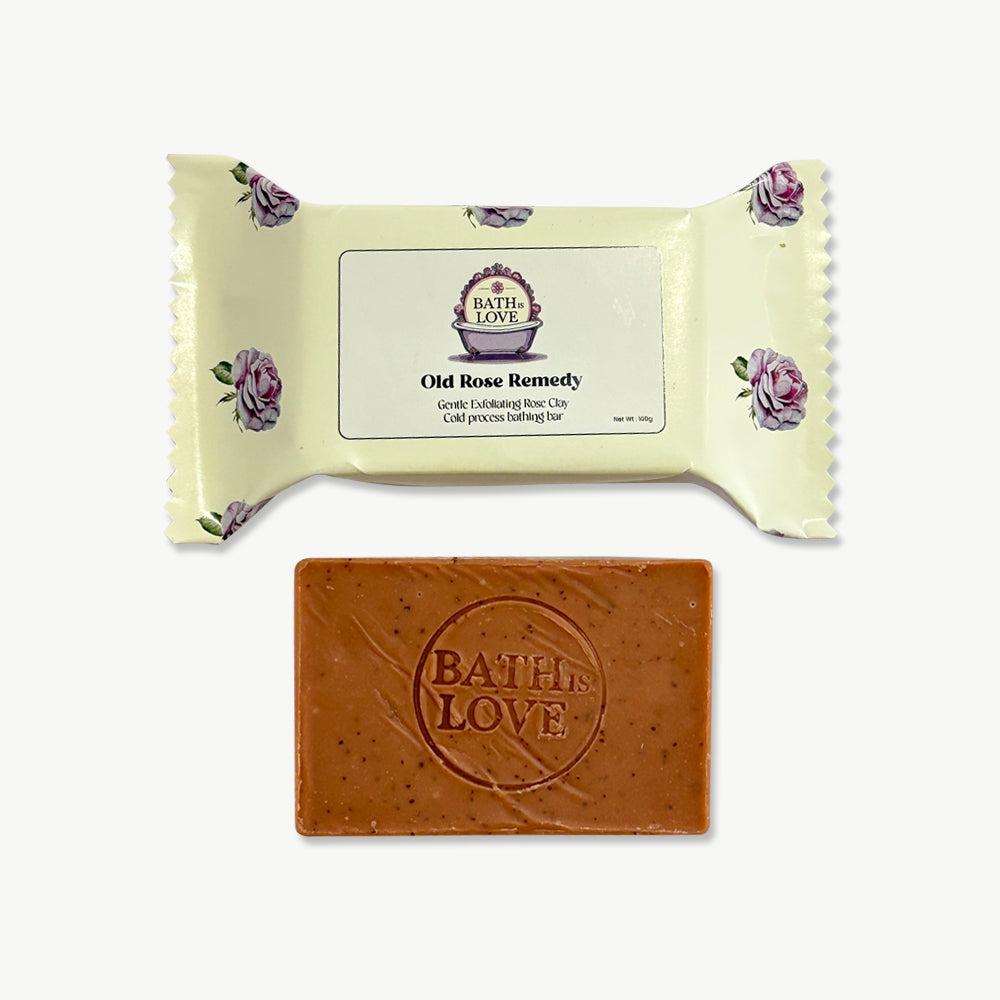 Bar of soap with 'Bath Love' branding and a decorative wrapper on a white background
