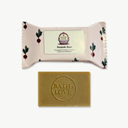 Bar of soap with 'Bath is Love' branding on a white background