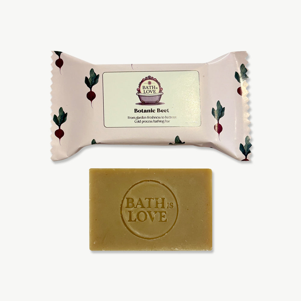 Bar of soap with 'Bath is Love' branding on a white background