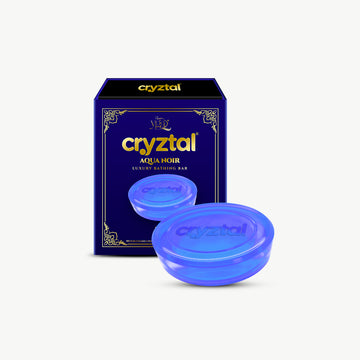 cryztal Aqua Noir luxury bath bar packaging with two blue bath bombs on a white background