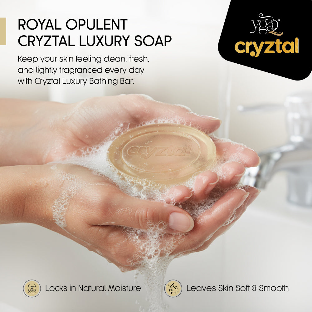 Cryztal Luxury Soap being held in hands with soap suds, brand logo visible