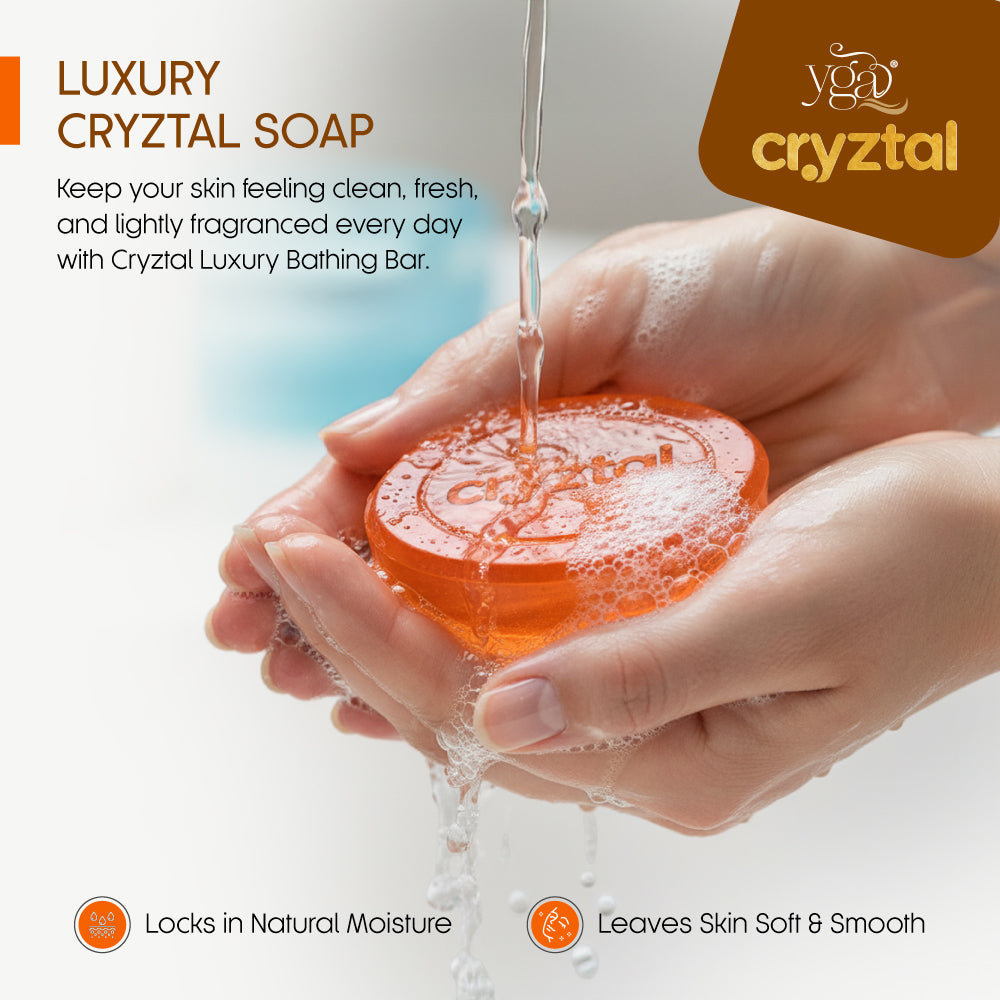 "Cryztal Golden Cedar luxury soap being lathered in hands with water"