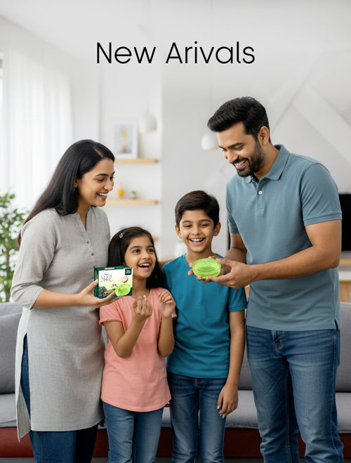 Family of four holding green products in a modern living room with 'New Arrivals' text.