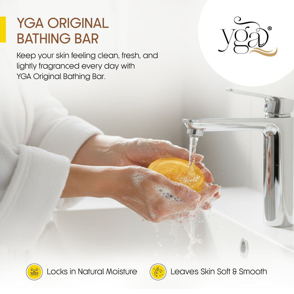 Person washing hands with a YGA Original Bathing Bar in a sink, with product branding visible.